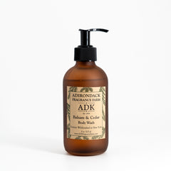 Brown bottle of Adirondack Fragrance Farm body wash on a white background