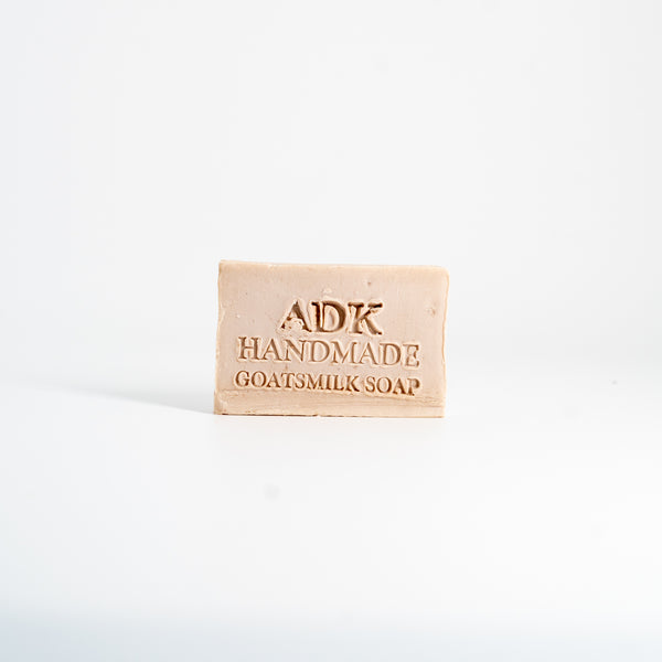 Bar of ADK Handmade Goatsmilk Soap on a white background