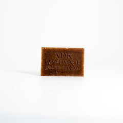 Bar of soap with 'ADK Handmade' branding on a white background