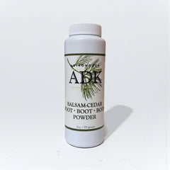 White container of ABDK Balsam-Cedar Root Boot Powder on a white background