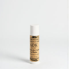Lip balm stick with 'ADK' branding on a white background