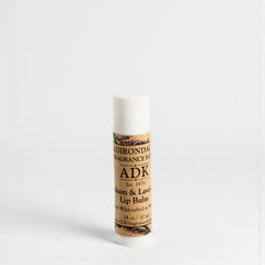 Lip balm stick with a brown label on a white background