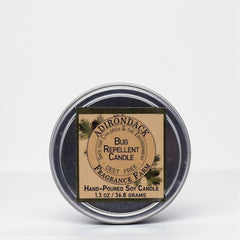 Bug repellent candle in a tin with a label on a white background