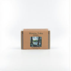 Handmade soap bar with 'Shinrin-Yoku' packaging on a white background