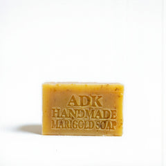 Bar of ADK Handmade Marigold Soap on a white background