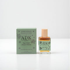 ADK perfume bottle and packaging on a white background
