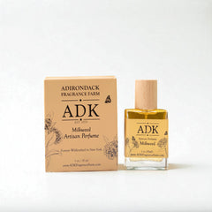 ADK milkweed artisan perfume bottle and packaging on a white background