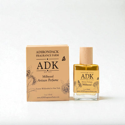 ADK milkweed artisan perfume bottle and packaging on a white background