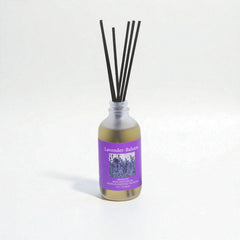 Reed diffuser with lavender and balm label on a white background