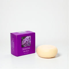 Shampoo bar and packaging with 'Lilac Flower' label on a white background