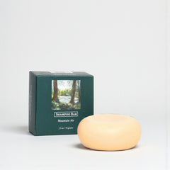 Shampoo bar and packaging with 'Mountain Air' text on a white background