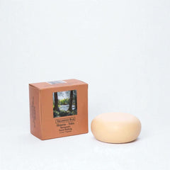 Shampoo bar and packaging on a white background