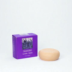 Shampoo bar and purple packaging with lavender image on a white background