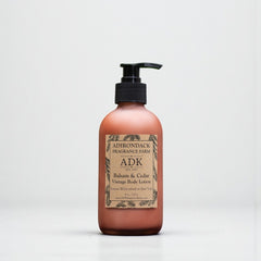 Bottle of Adirondack Fragrance Farm lotion on a white background